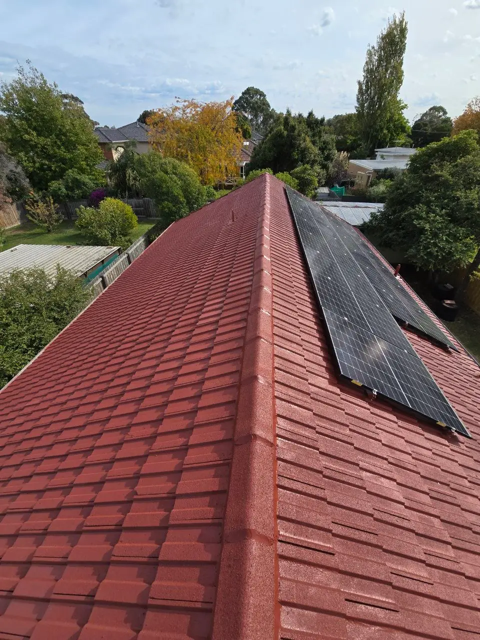 Restored terracotta tile roof with fresh ridge capping, Melbourne — project 1