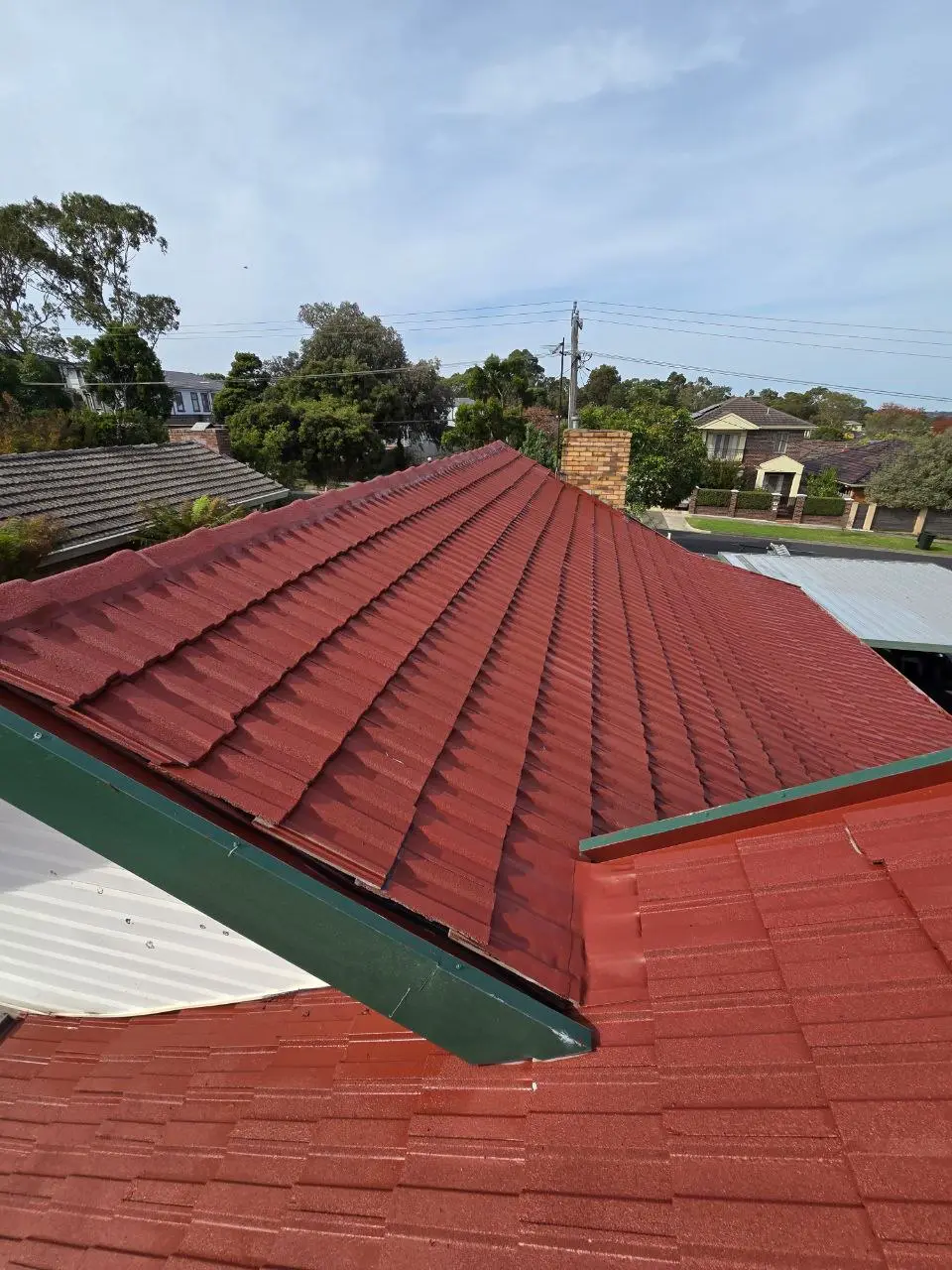 Restored terracotta tile roof with fresh ridge capping, Melbourne — project 3